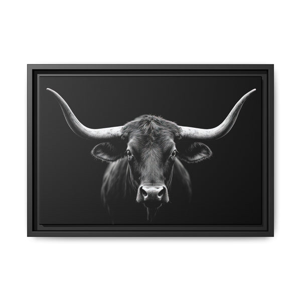Framed western canvas art with a monochrome bucking bull head on black, black frame