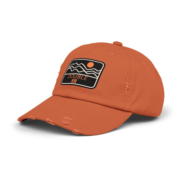 Burnt orange distressed dad hat, side view, with front patch logo and worn brim