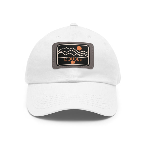 White dad hat with rectangle leather logo patch, gray patch background