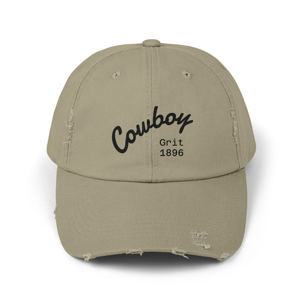 Distressed dad hat in light olive/khaki with Cowboy Grit 1896 logo on front