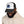 Bison Strong trucker hat on model: white front panel, black mesh back, black brim