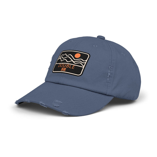 Blue distressed dad hat, side view, with front patch logo and frayed brim