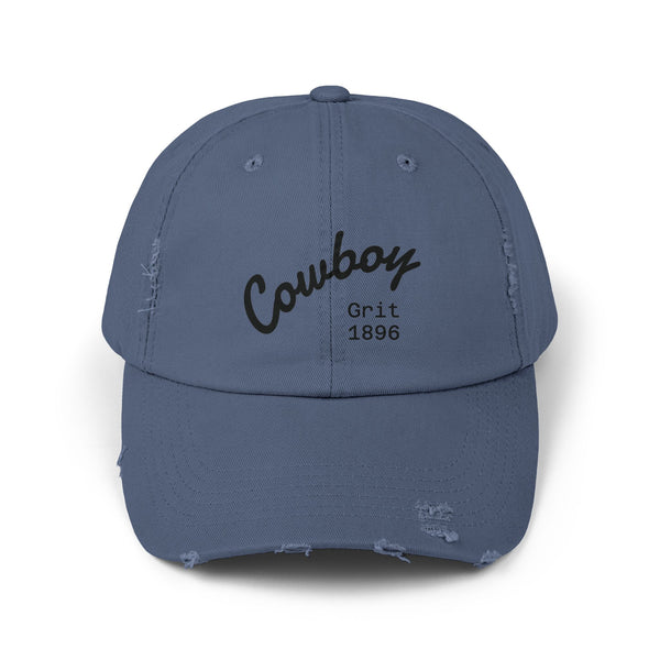 Distressed dad hat in blue with Cowboy Grit 1896 logo stitched on front