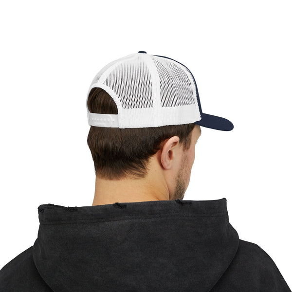 White-and-navy trucker hat worn from behind with mesh panels and adjustable strap