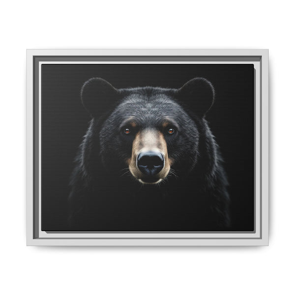 Framed canvas art of a black bear face, light gray frame with inner mat