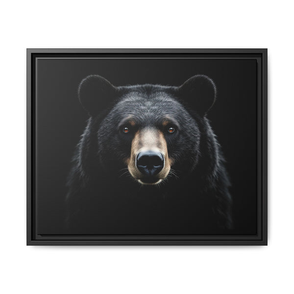 Framed canvas art with a centered black bear face, black frame and dark mat