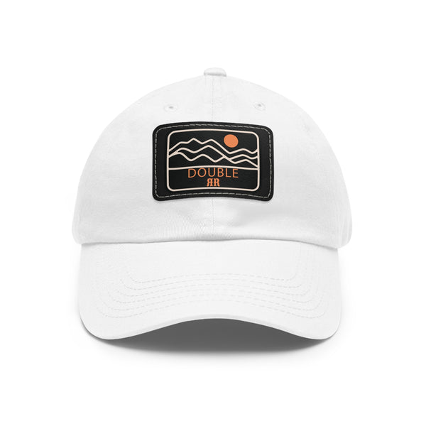 White dad hat with rectangle leather logo patch, black patch background