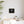 Small framed canvas bear wall art with centered dark bear face portrait in a light frame