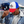 White and blue trucker hat with red brim and Restore West horse graphic