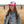 Pink trucker hat with white front panel and Restore West horse graphic