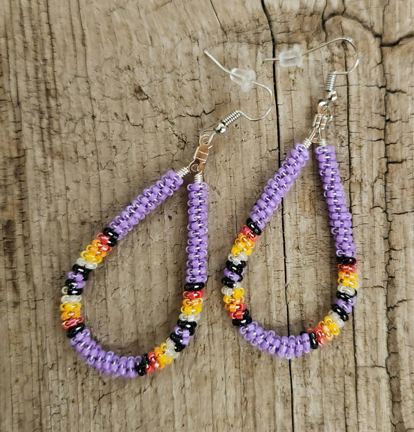 Purple seed-bead hoop earrings with multicolor bead accents and silver hooks