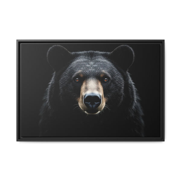 Framed canvas art of a black bear face, black frame with dark inner mat
