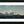 Black-framed landscape art print featuring snowy mountain peaks