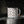 Enamel camp mug with black rim and brown horseshoe pattern, white body and handle