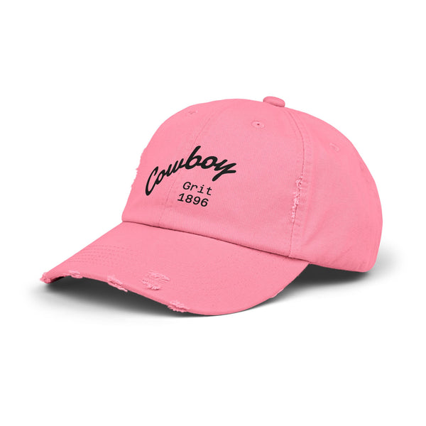 True Pink distressed dad hat with distressed Cowboy Grit 1896 logo on front