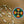 Beaded necklace with white striped tubular beads and round multicolor medallion