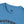 Blue T-shirt with crew neckline and small RR Western logo at the collar