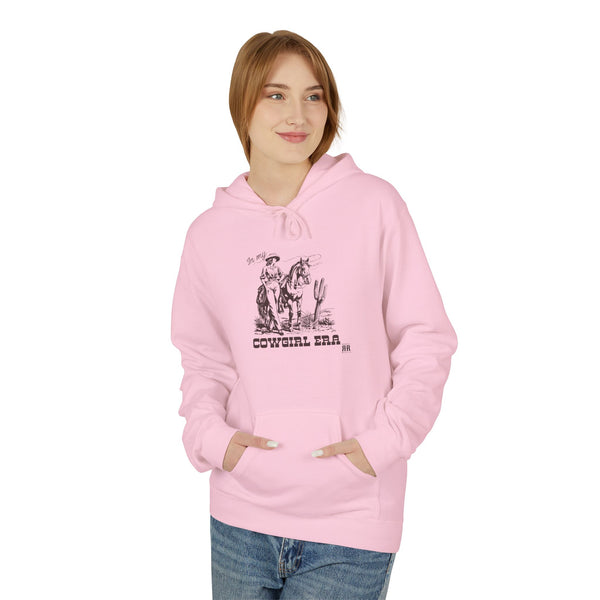 Light pink western hoodie on model with cowboy graphic, hood and pouch pocket