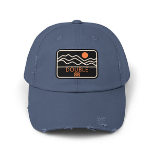 Blue distressed dad hat with front patch logo and frayed brim