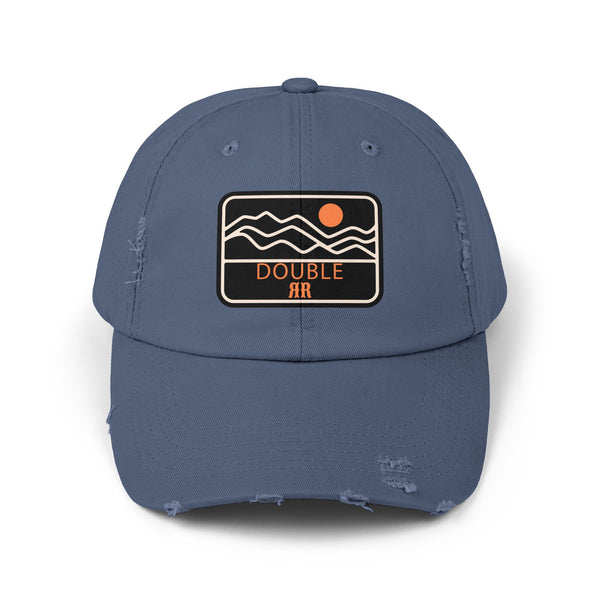 Blue distressed dad hat with front patch logo and frayed brim