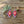 Beaded diamond earrings with red, white, and dark bead patterns