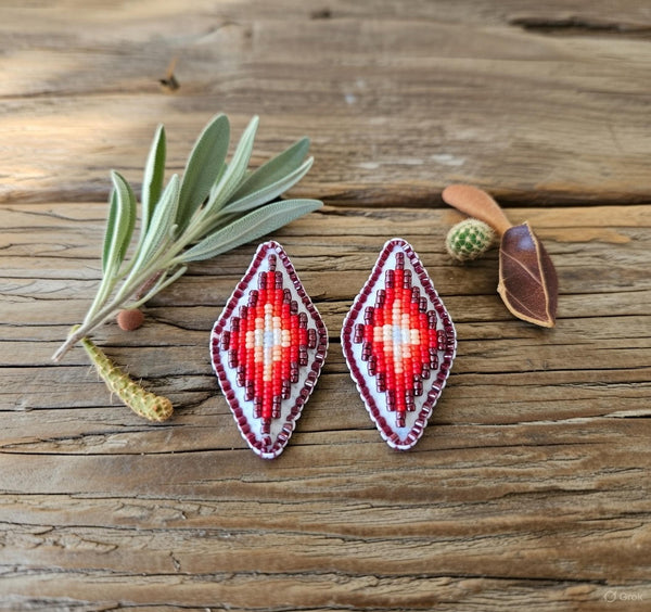 Beaded diamond earrings with red, white, and dark bead patterns