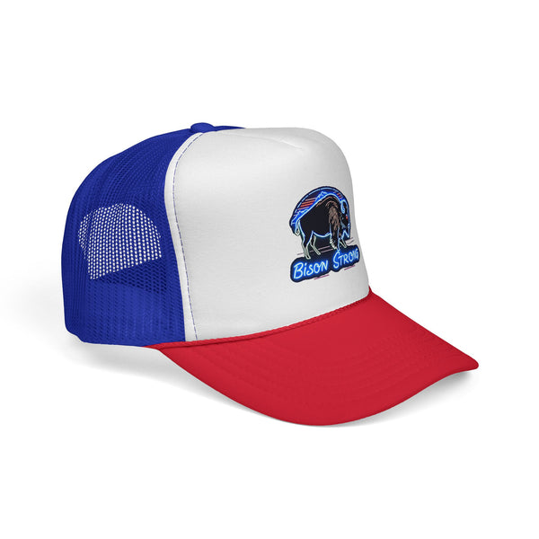Trucker hat angled view: white front panel, blue mesh, red underside brim, bison logo