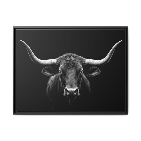 Framed western canvas art showing monochrome bucking bull head, black frame