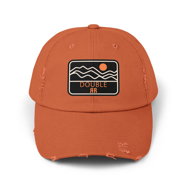 Burnt orange distressed dad hat with front patch logo and worn brim