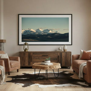 Framed “Lost in Montana – Bozeman Range” panoramic mountain art above a rustic console in a western-style living room