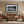 Framed black-and-white St. Helens panoramic wall art displayed in a western-style living room with rustic decor