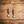 Long beaded earrings: red/blue/orange beads with a silver buffalo-coin drop