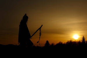 “Silhouette of a Native American warrior at sunset, symbolizing heritage and cultural strength.”