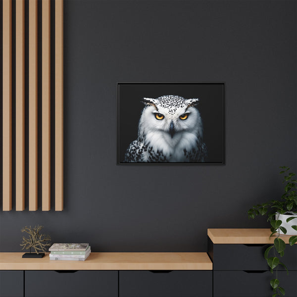 Small framed canvas wall art of a snowy owl face with amber eyes, black frame